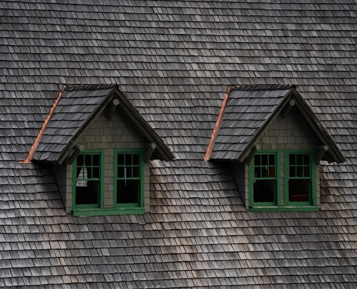 Dormers on a shingle roof in Owensboro, KY, where step flashing and kickout flashing carry water past the walls